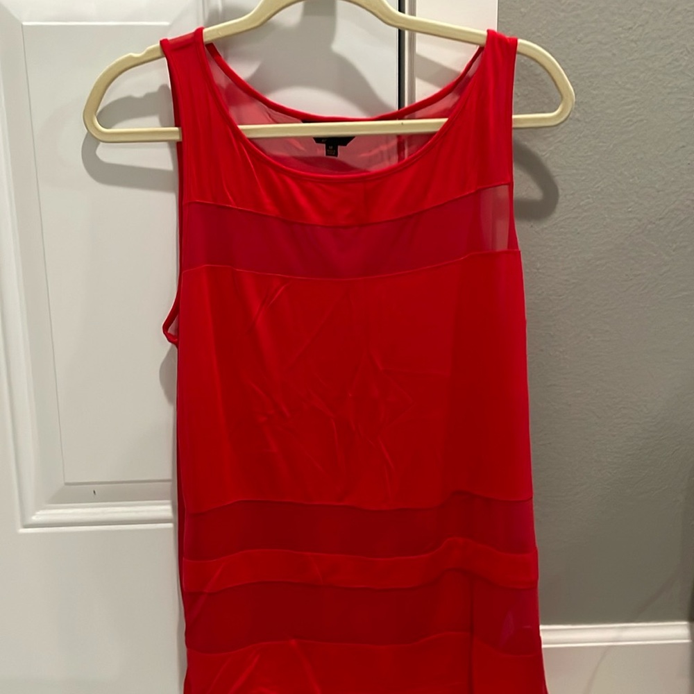 Sheer and solid sleeveless red top